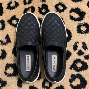 Steve Madden black tufted leather slip-one.